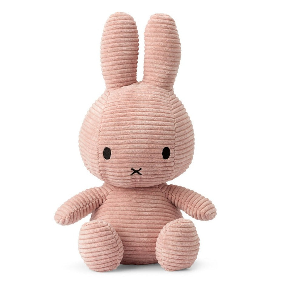 Pink corduroy Miffy bunny plush toy sitting.