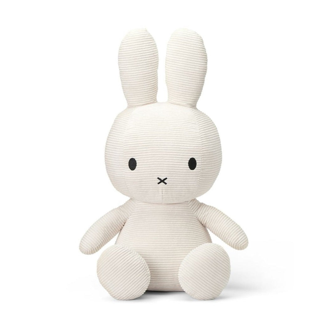 White corduroy Miffy plush toy sitting upright.
