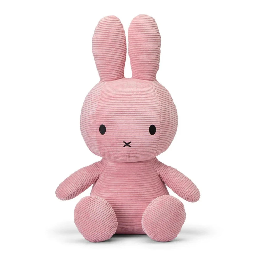 Pink corduroy Miffy plush toy sitting upright.