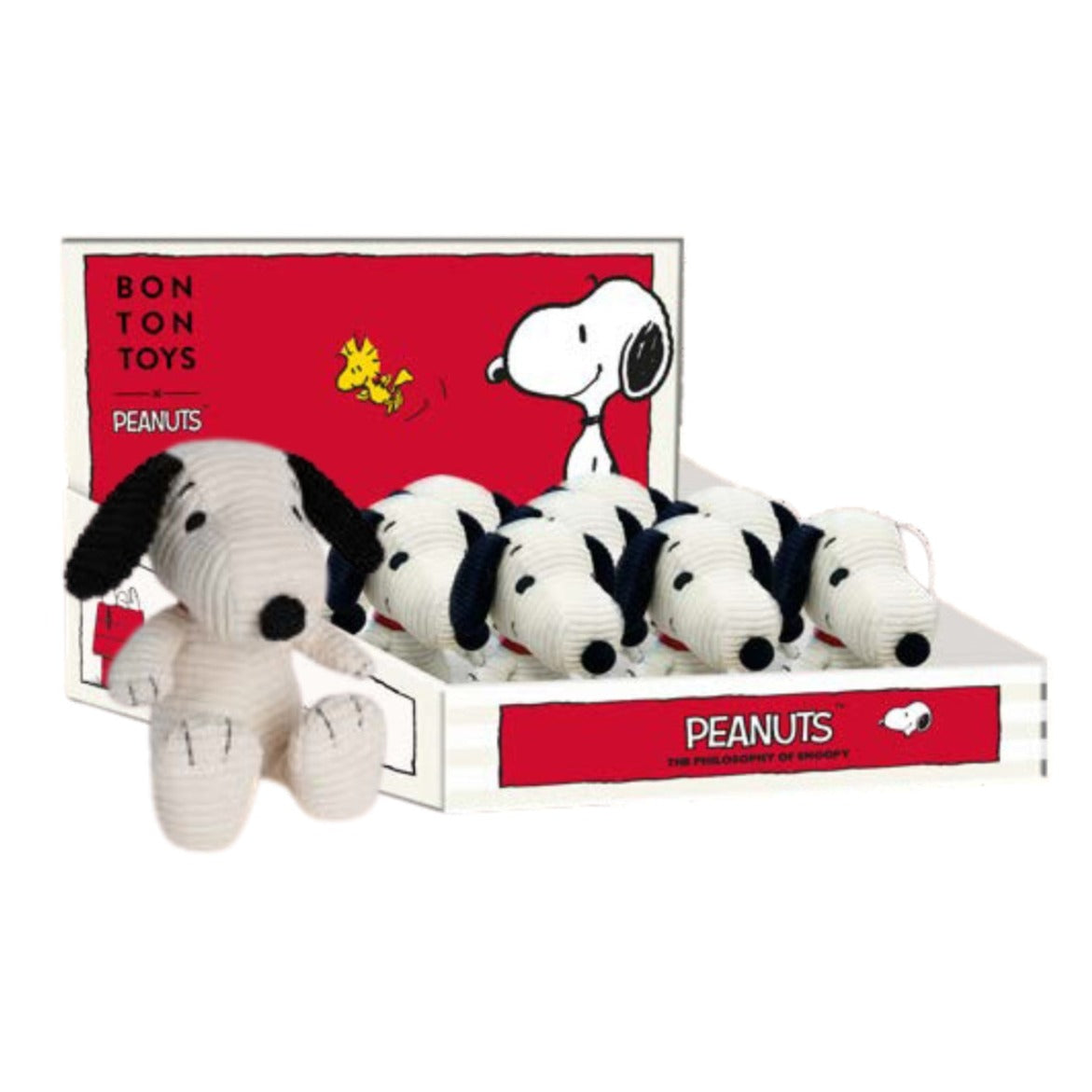 Several Snoopy plush toys in a display box.