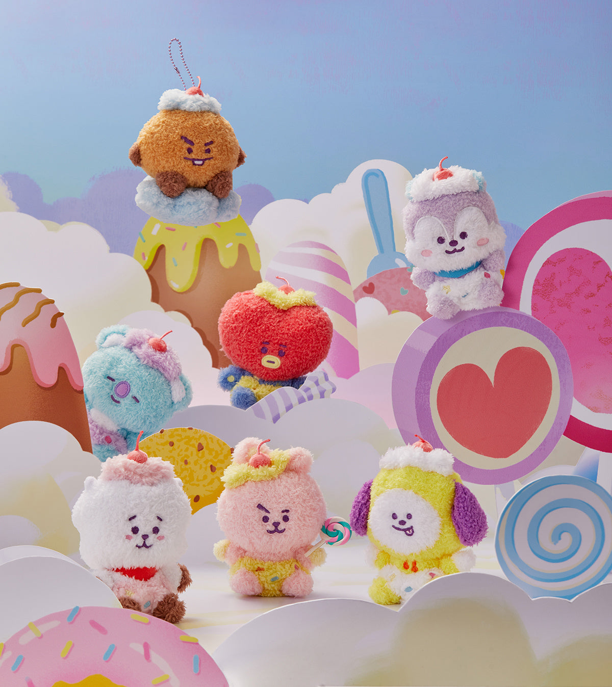 Plush toy characters in dessert-themed setting.