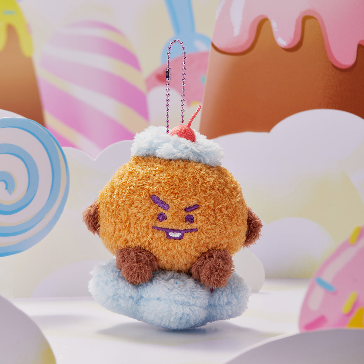 Orange, plush BT21 character toy as an ice cream sundae with a blue cloud base and dessert-themed background.