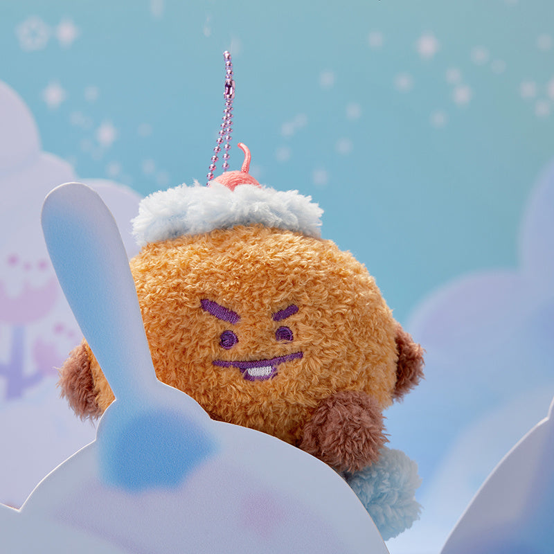 BT21 plush charm of Cooky wearing a snow hat, with a chain attached.