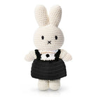 Crocheted Miffy rabbit doll wearing a black dress.