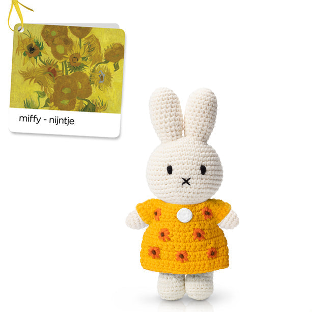 Crocheted Miffy bunny wearing a yellow sunflower dress.