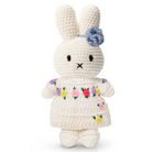 Crocheted Miffy bunny doll in floral dress.