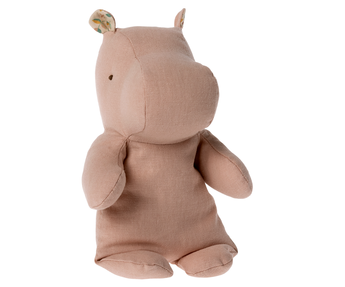 Stuffed pink hippo toy with patterned ears.