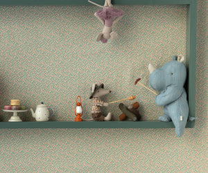 Here are some descriptive alt tags for the product image, focusing on visual details:
* Shelf with stuffed animals: rhino, mouse, ballerina toy, teapot, macarons.
* Blue plush rhino toy leaning against a painted shelf.
* Children's room wallpaper with teal background and small speckled pattern.
* Close-up of shelf with toys: mouse playing drum, miniature lantern, teal teapot, small macarons.