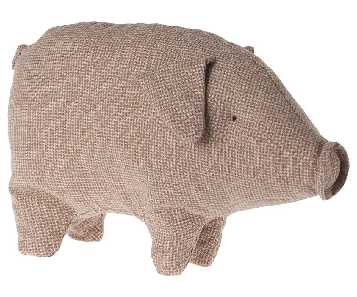 Stuffed brown pig with patterned fabric.