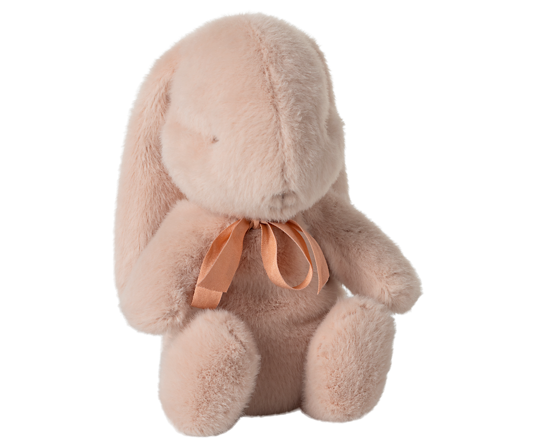 Pink, plush bunny with a peach ribbon.