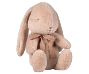 Tan plush bunny with ribbon.