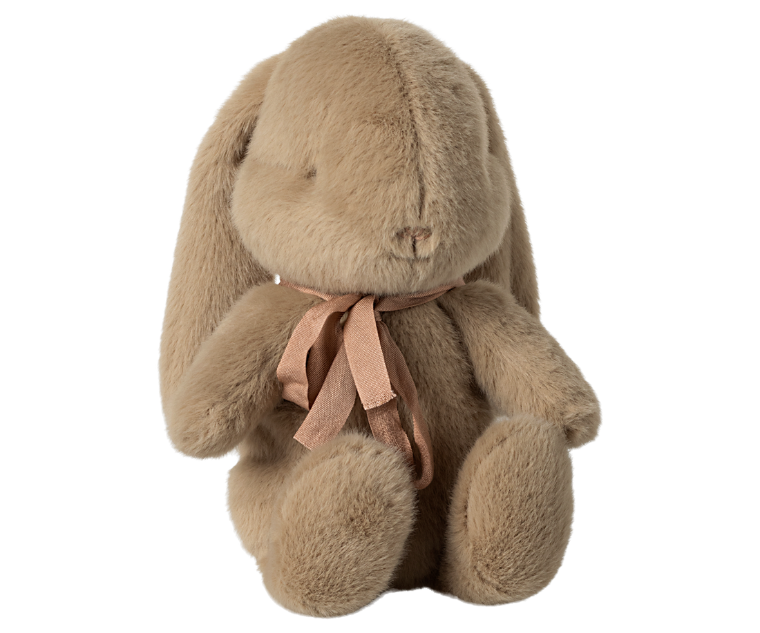 Tan stuffed bunny toy with a pink ribbon.