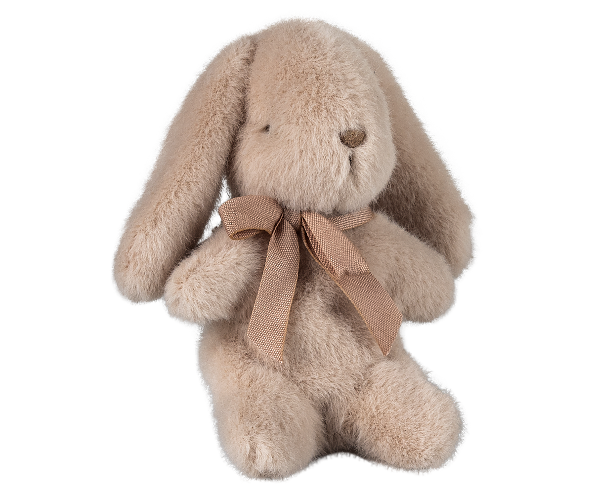 Tan stuffed bunny with a ribbon bow.