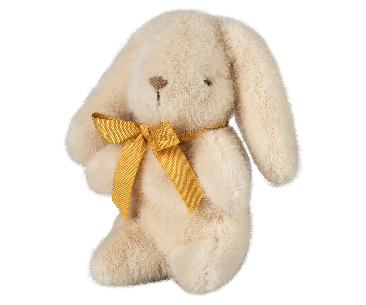 Stuffed bunny with yellow ribbon.