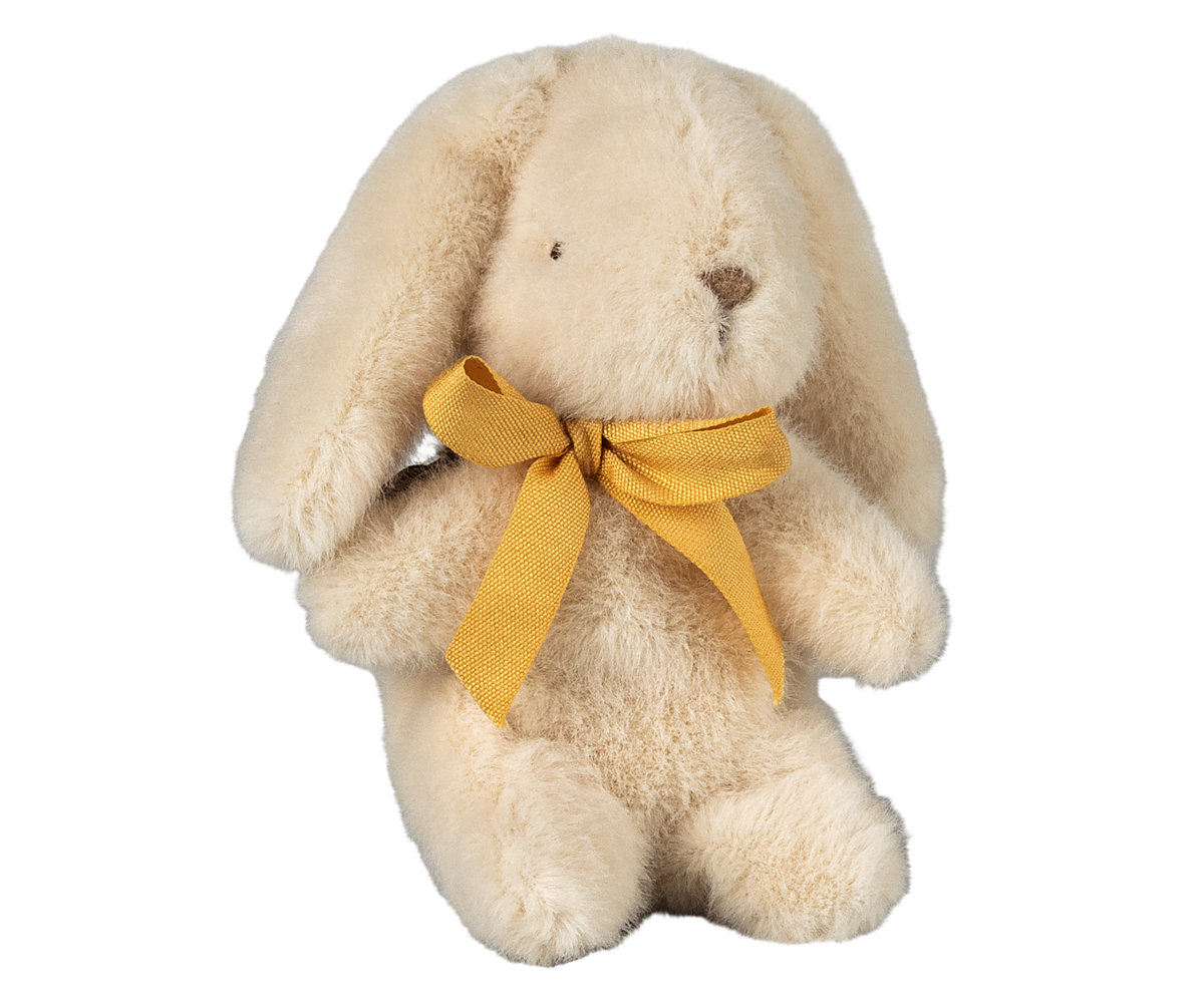 Stuffed bunny toy with yellow bow tie.