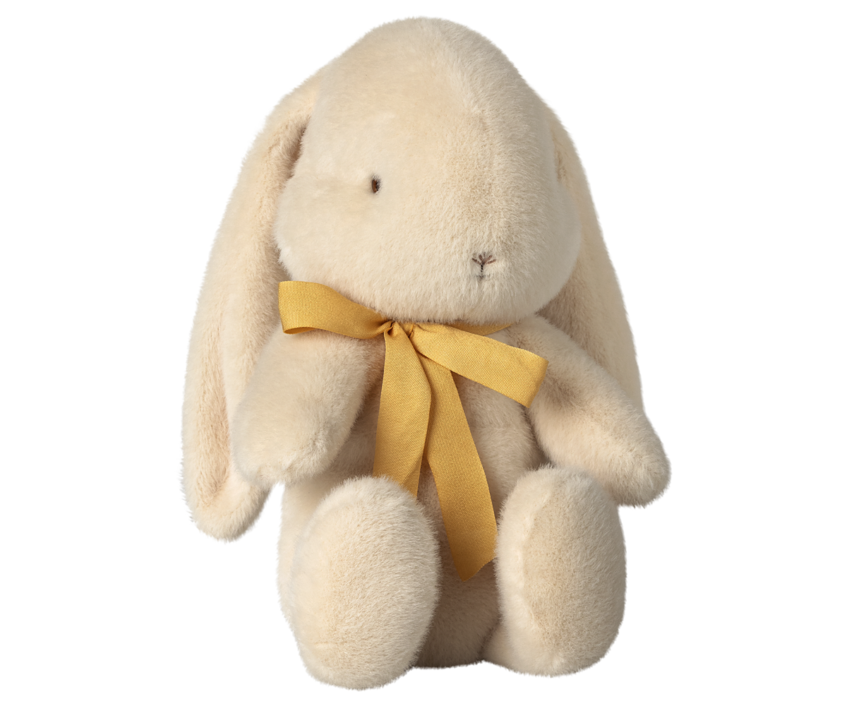 Stuffed bunny with a yellow ribbon.