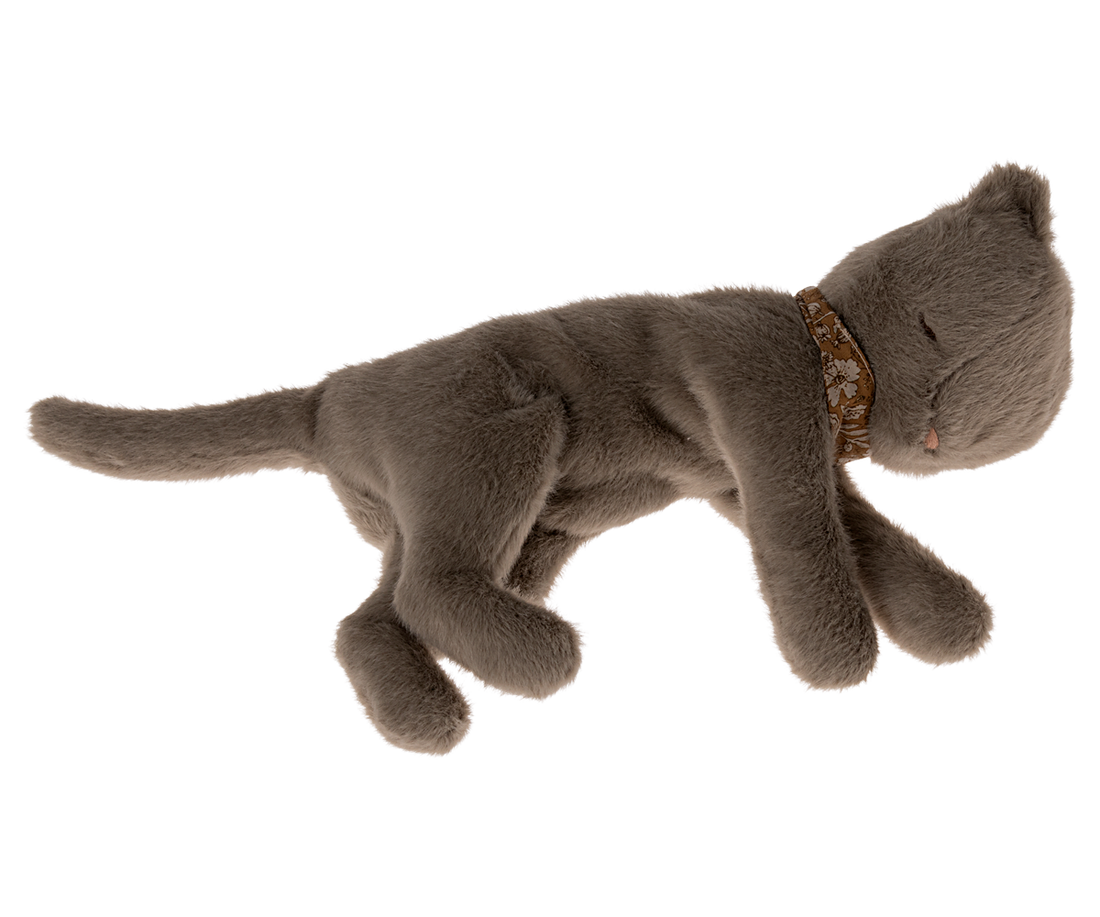 Stuffed gray cat with floral collar.