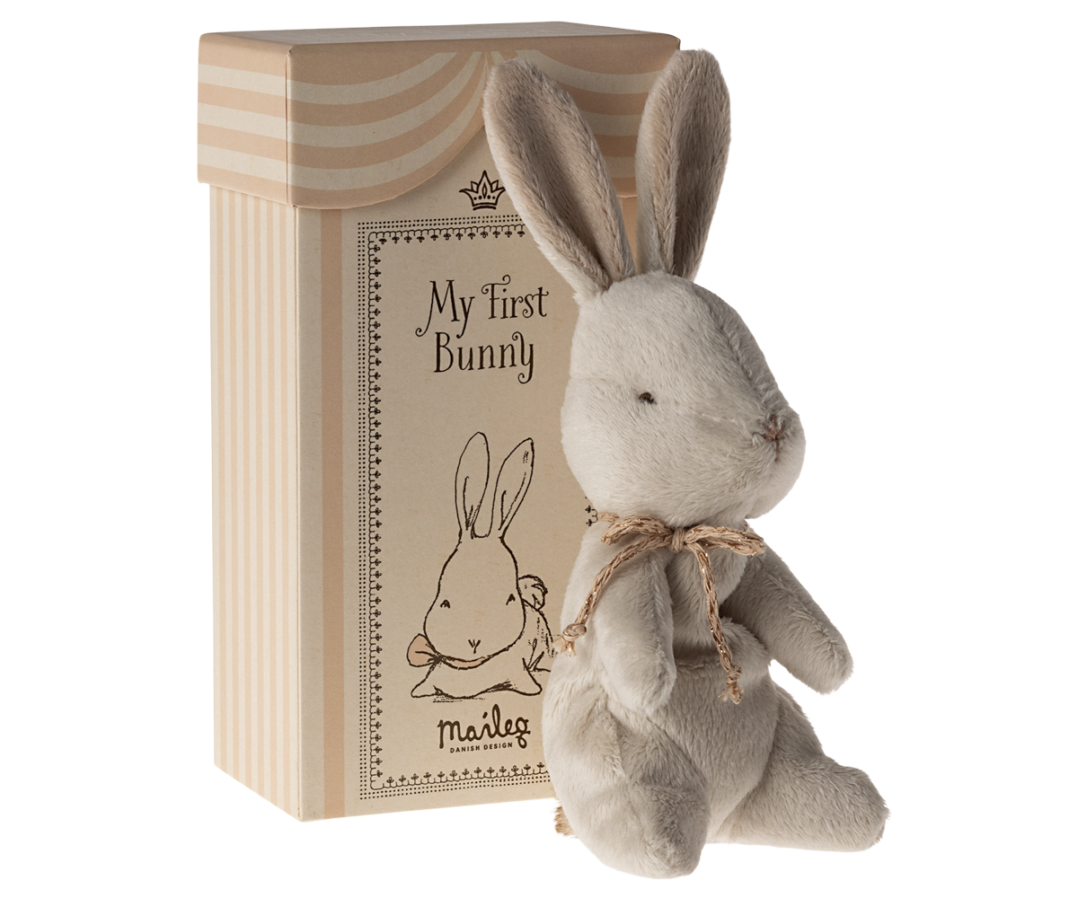 Tan plush bunny with a gift box.