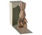Stuffed brown bunny in a box with birth information.