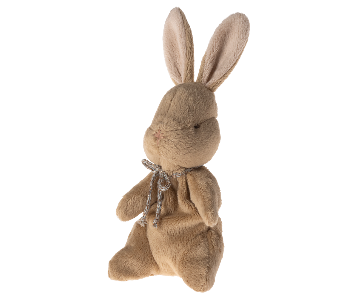 Brown plush rabbit toy with silver bow.