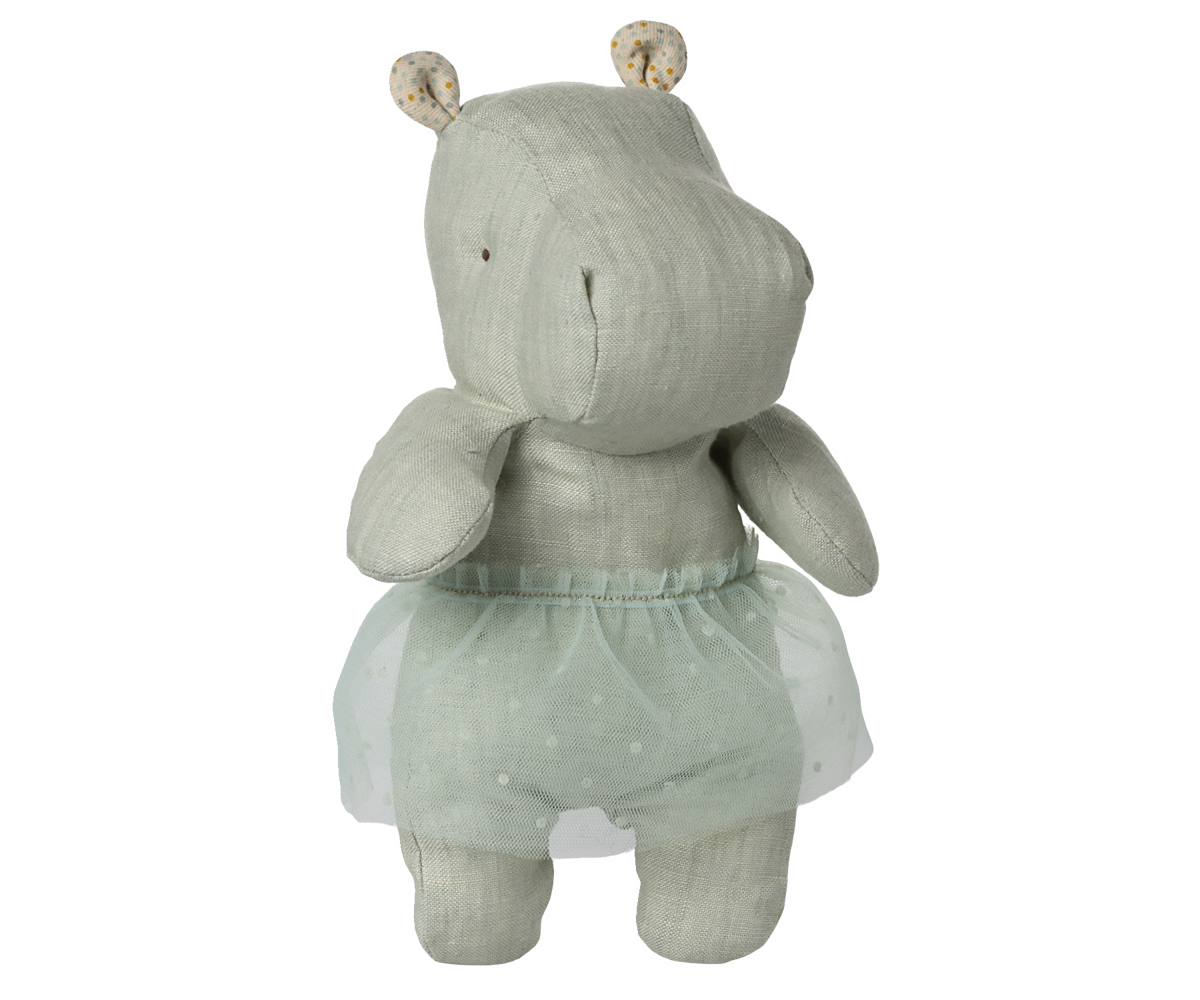 Stuffed hippo toy wearing a light blue tutu.