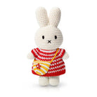 Crocheted Miffy bunny wearing red and white striped dress with yellow purse.