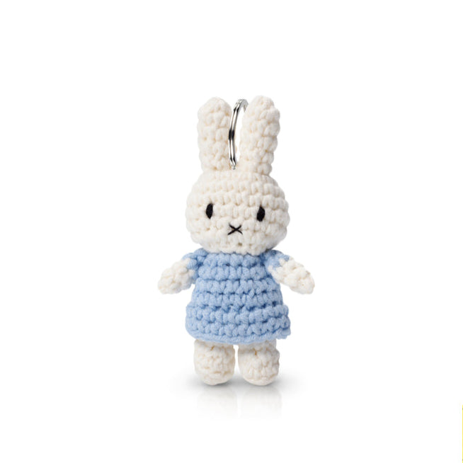 Crocheted Miffy keychain in blue dress.