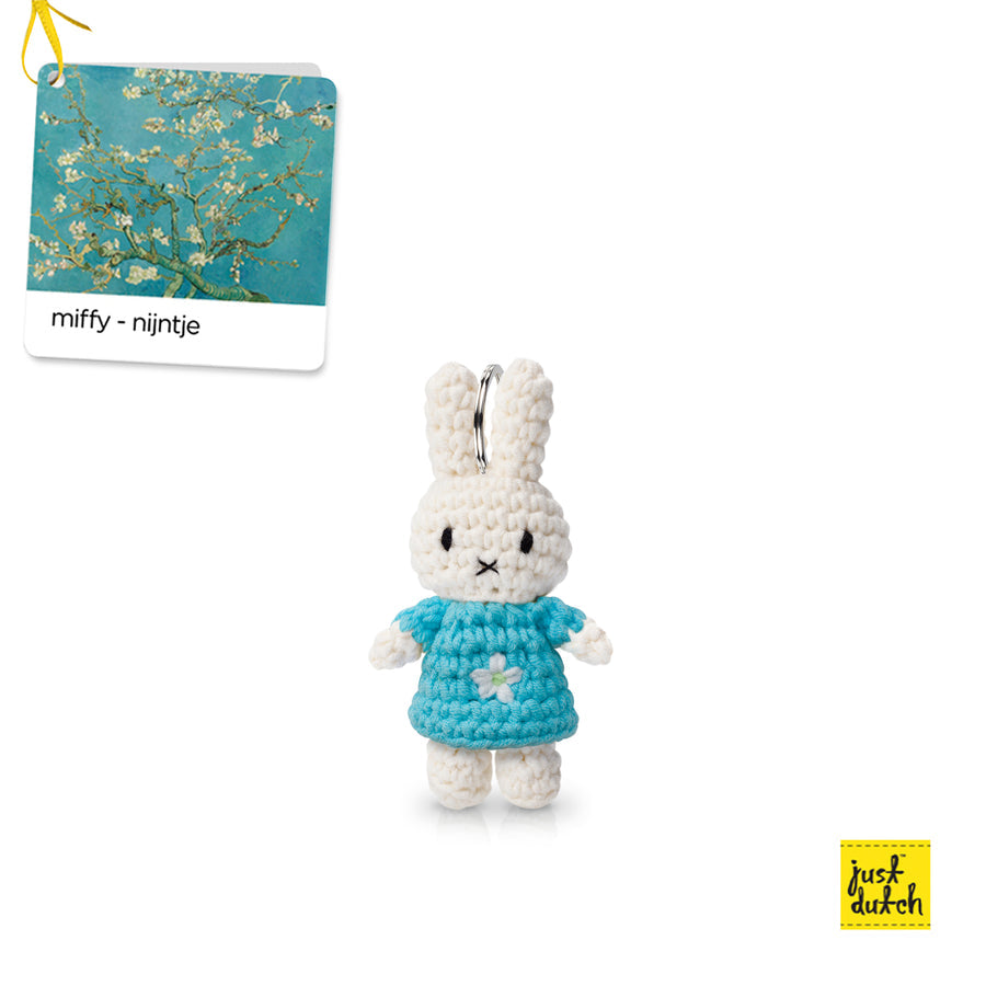 Crocheted Miffy-Nijntje bunny keychain in blue dress.