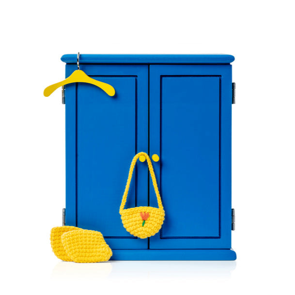 Blue wardrobe with yellow accessories.