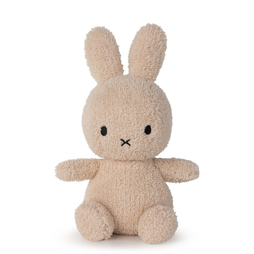 Tan Miffy plush toy with black eyes and stitched mouth.