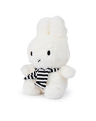 White plush Miffy toy wearing a black and white striped scarf.