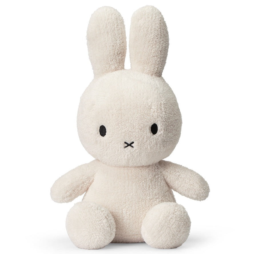 Beige stuffed bunny sitting upright.