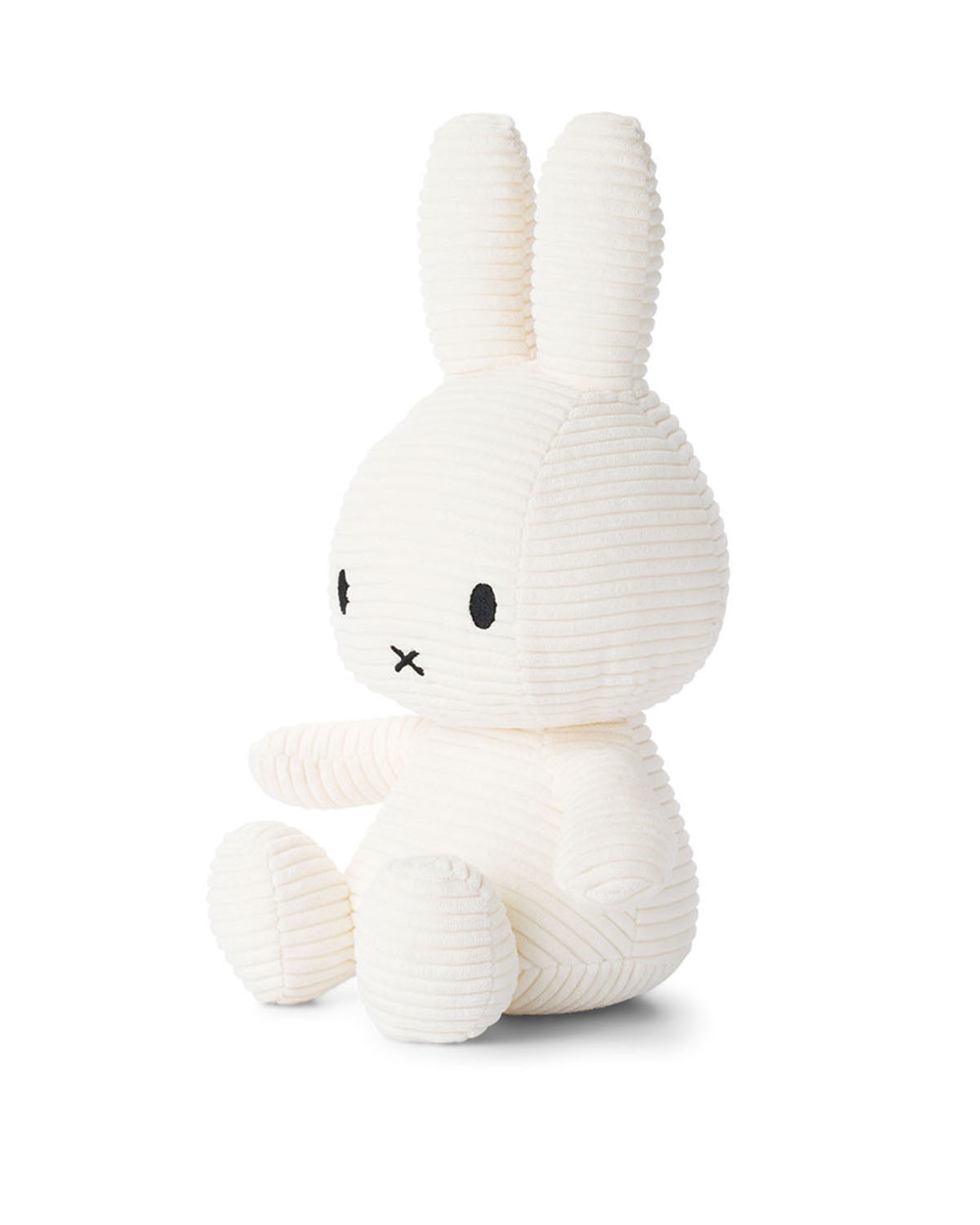 White corduroy stuffed bunny toy sitting.