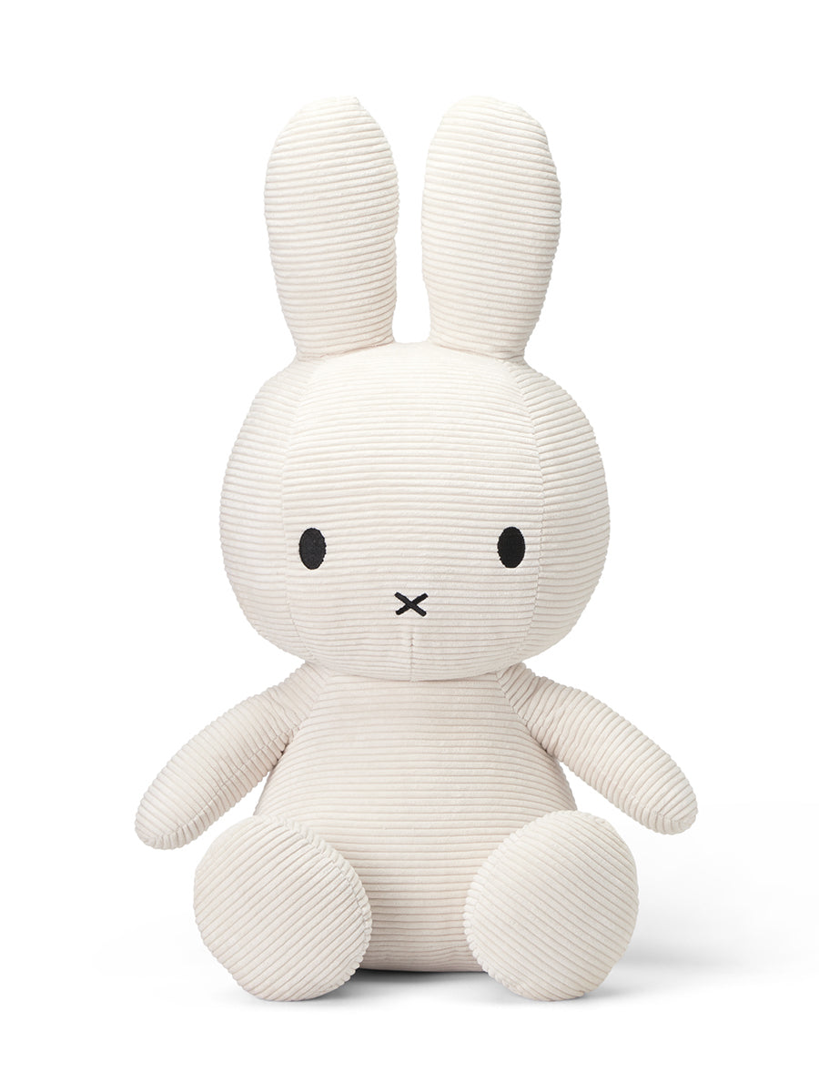 Beige corduroy Miffy plush toy sitting upright.