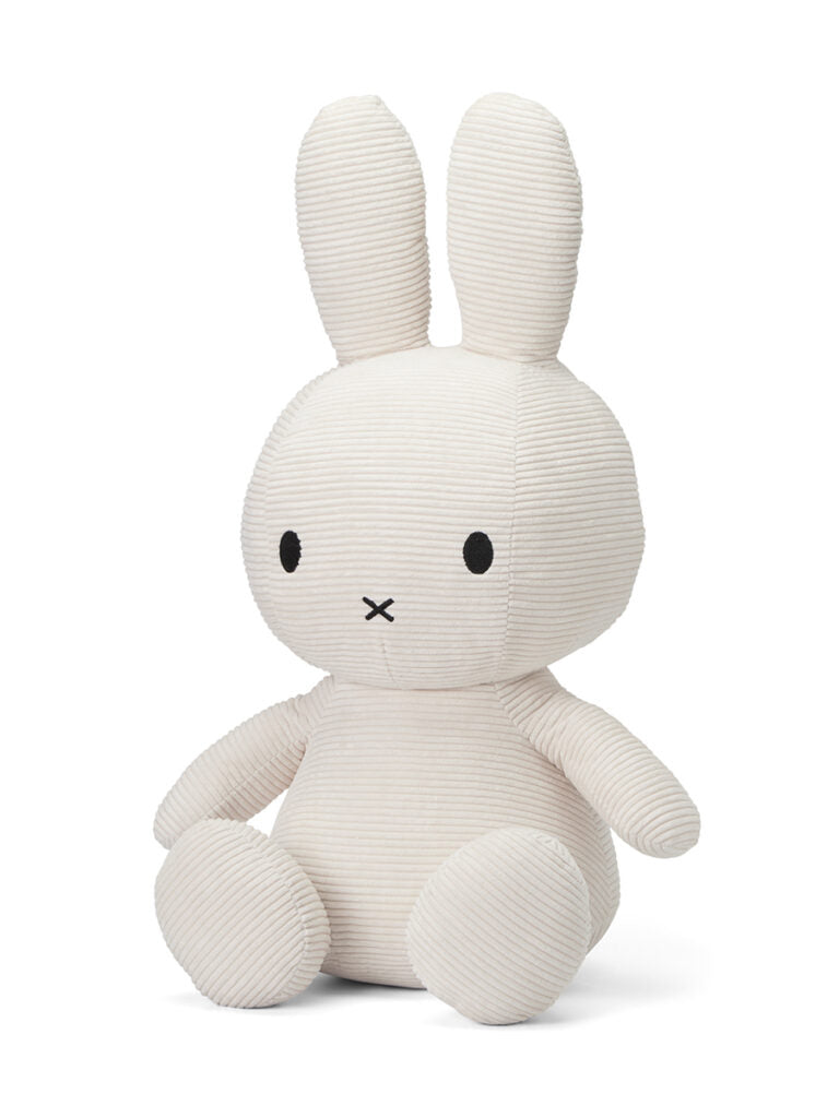 Cream-colored, corduroy Miffy plush toy sitting upright.