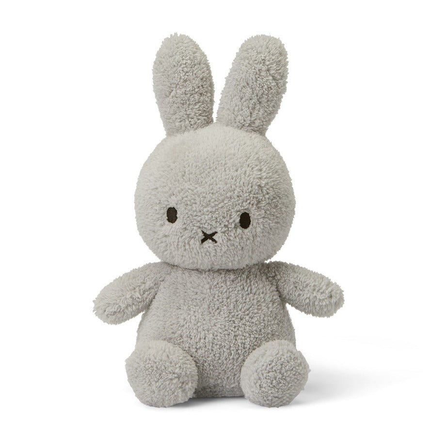 Gray, plush bunny toy with long ears. It has simple embroidered features.