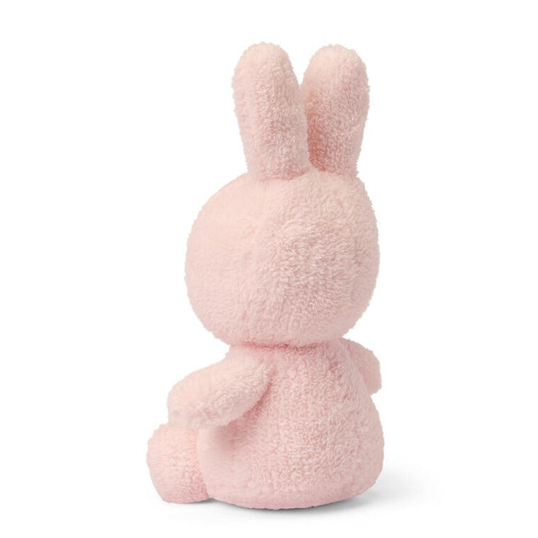 Rear view of a pink plush bunny.