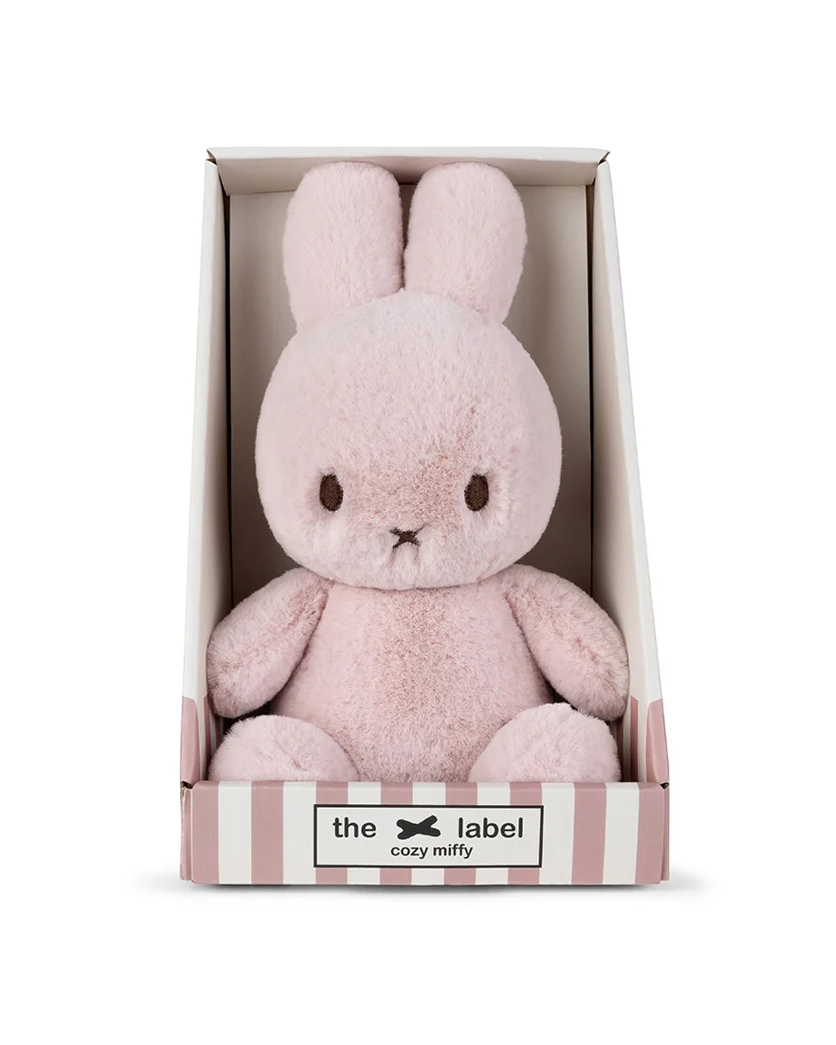 Pink plush bunny toy in a box with 'the label cozy mitzy' branding on a white background
