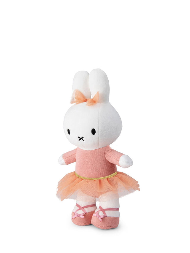 Plush toy of a character in a pink dress with a white background
