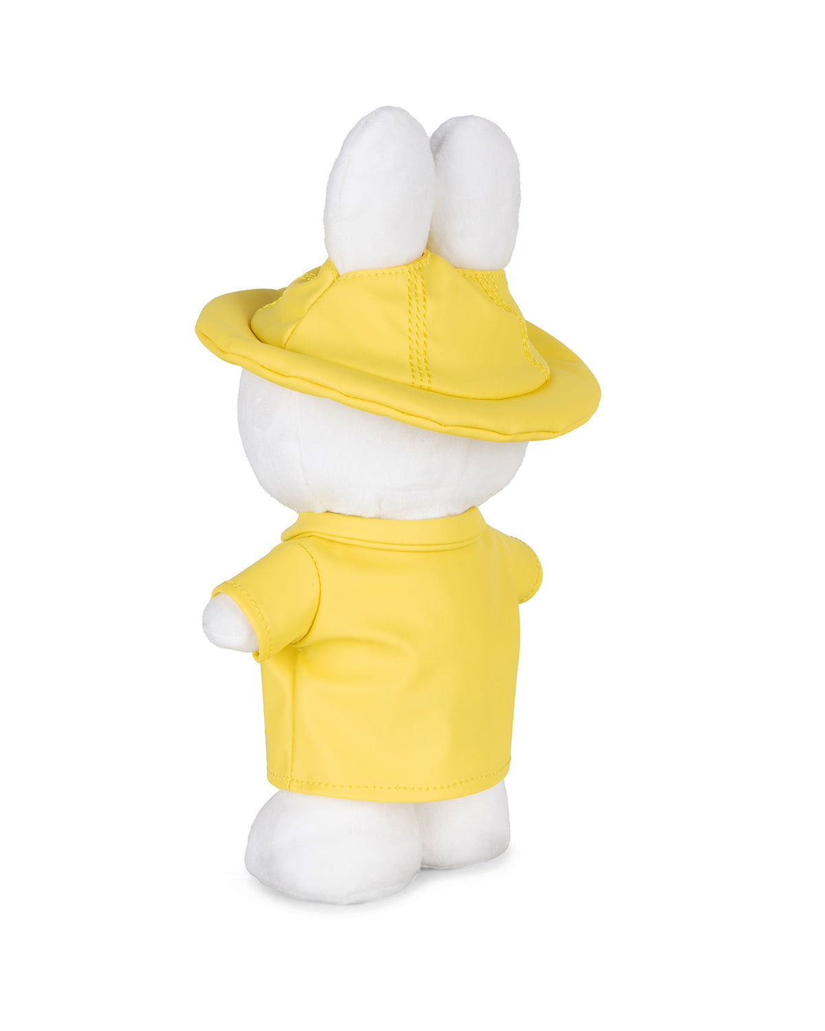 White plush rabbit in yellow jacket and hat, viewed from the back.
