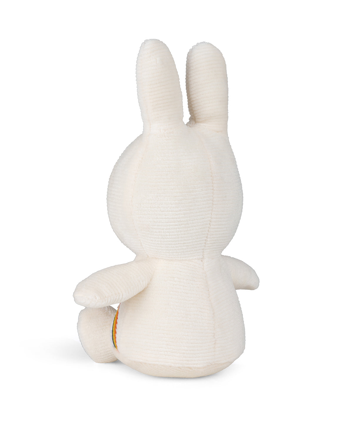 Back view of a cream-colored plush bunny toy.