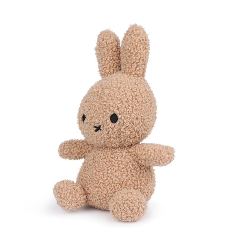 Tan, plush Miffy rabbit toy.