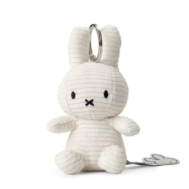 Off-white corduroy bunny keychain with silver ring.