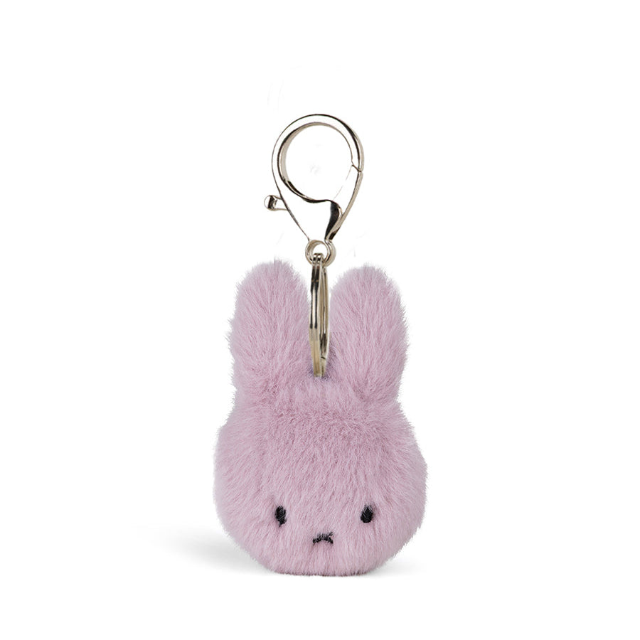 A small fuzzy bunny keychain charm in light pink with a silver metal clasp, shown on a plain white background.