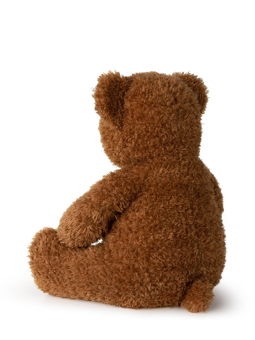 Rear view of a brown teddy bear.