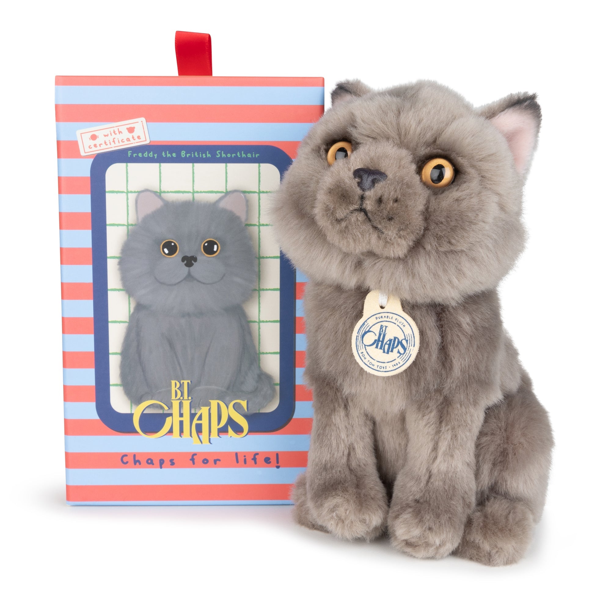 Stuffed gray cat plush toy with tag, next to the striped box.