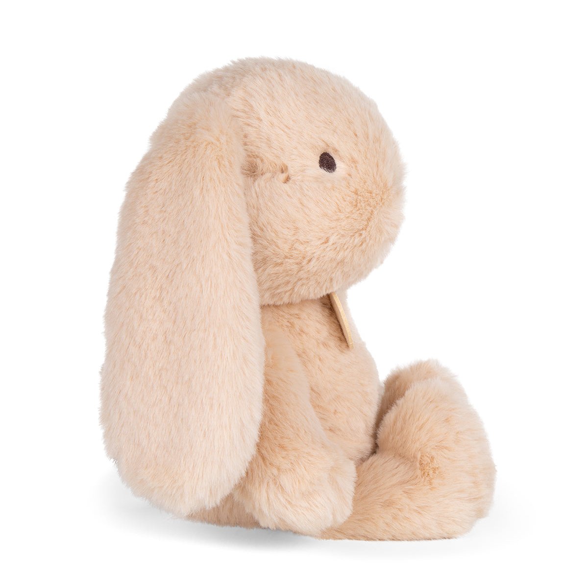 Stuffed bunny in peach-colored fur.
