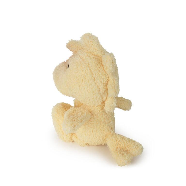 Stuffed horse toy, cream-colored, fluffy texture, seated pose.