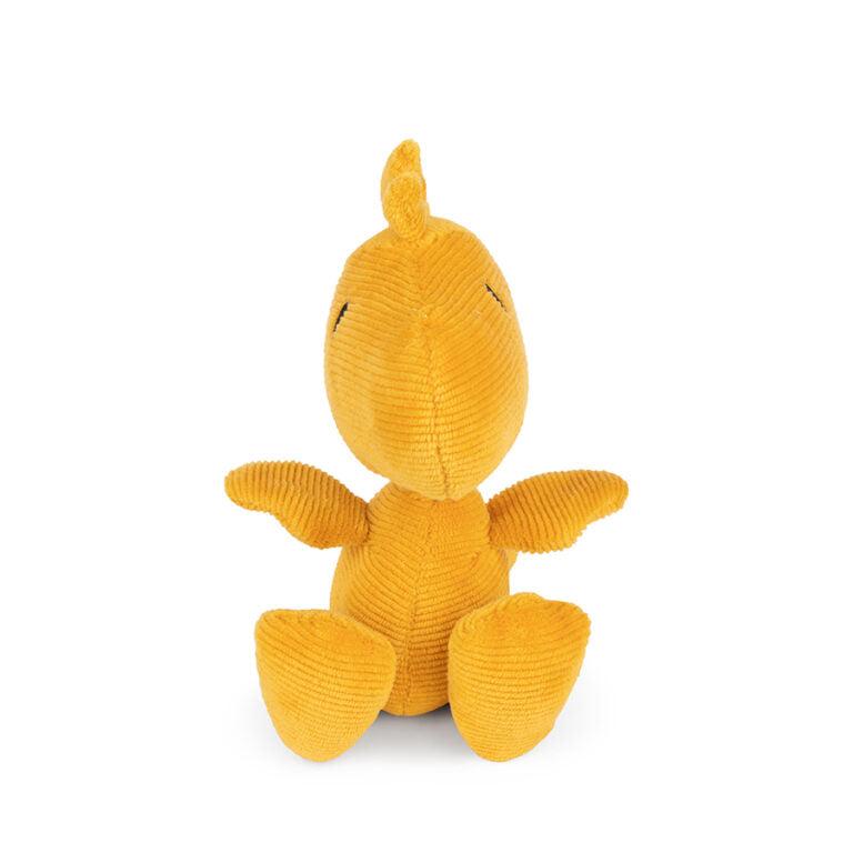 Yellow corduroy dinosaur stuffed animal sitting up.