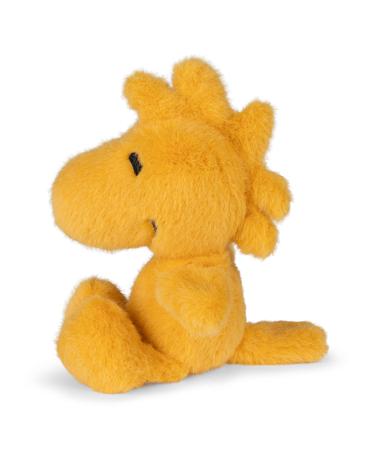 Plush yellow Woodstock doll sitting.